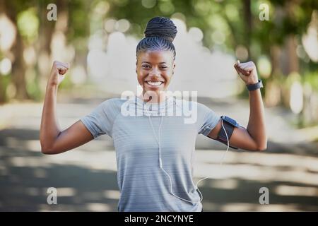 Strong black woman flexing arms, muscle and body power, fitness and  wellness in urban Jamaica outdoors. Portrait proud female athlete energy,  exercise and happiness of healthy bodybuilder lifestyle Stock Photo