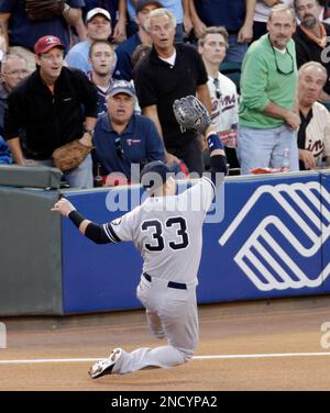 New York Yankees Outfielder Nick Swisher (#33) heads to first. The