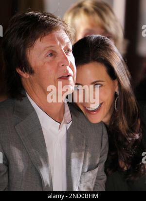 British musician Paul McCartney and his girlfriend Nancy Shevell watch Stella McCartney's spring-summer 2011 ready to wear fashion collection show, presented in Paris, Monday, Oct. 4, 2010. (AP Photo/Thibault Camus)