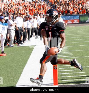 Oregon State's Jacquizz Rodgers (1) scores against Oregon's Spencer  Paysinger (35) during the first half of an NCAA college football game in  Eugene, Ore., Thursday Dec. 3, 2009. Oregon beat Oregon State