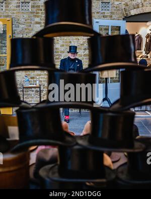 'the last stop for the curious vintage' store that sells top hats at Spitalfields Market in east London. Stock Photo