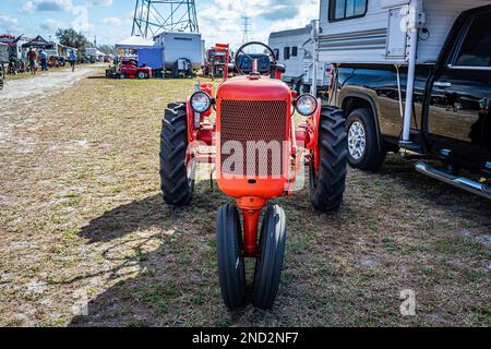Fort Meade, FL - February 24, 2022: High perspective front view of a 1948 Allis Chalmers Model C Farm Tractor at a local tractor show. Stock Photo