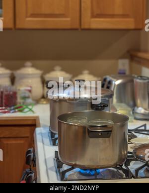 Canning venison in a northern Wisconsin kitchen. Stock Photo