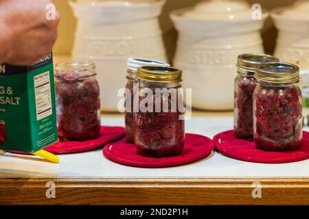 Canning venison in a northern Wisconsin kitchen. Stock Photo