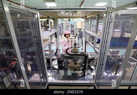 ZIXING, CHINA - FEBRUARY 14, 2023 - Workers work at an automated production workshop of Huihua Electronics Co LTD in Zixing Economic Development Zone, Stock Photo