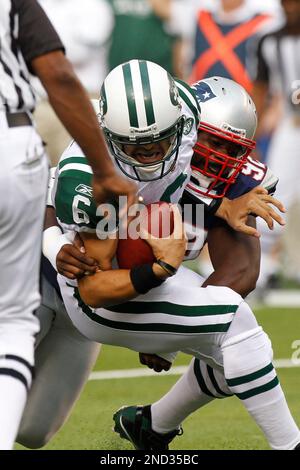 New England Patriots Gerard Warren sacks New York Jets Mark Sanchez for 10  yards in week 2 of the NFL season at New Meadowlands Stadium in East  Rutherford, New Jersey on September