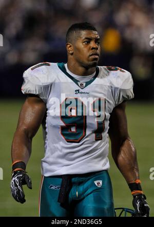 Miami Dolphins linebacker Cameron Wake looks on from the bench during the  fourth quarter of an NFL football game against the Chicago Bears, Thursday,  Nov. 18, 2010 in Miami. The Bears defeated