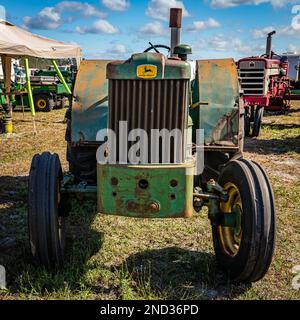 Fort Meade, FL - February 24, 2022: High perspective front view of a 1954 John Deere Model 40 Utility Orchard Tractor at a local tractor show. Stock Photo