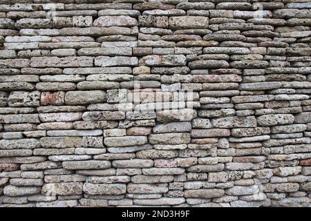 The wall is built of natural stone Stock Photo