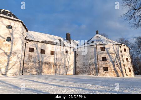 Turku Castle on a sunny winter day. It is a medieval building in the city of Turku in Finland. It was founded in the late 13th century and stands on t Stock Photo