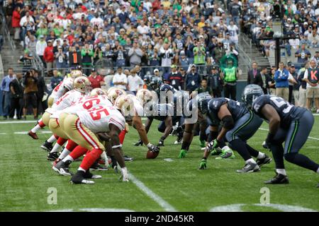 Seattle Seahawks vs. Minnesota Vikings. Fans support on NFL Game.  Silhouette of supporters, big screen with two rivals in background. Stock  Photo