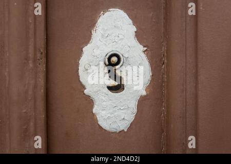 Old keyhole in old wooden door Stock Photo