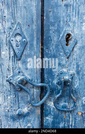 Old door latches and keyholes Stock Photo