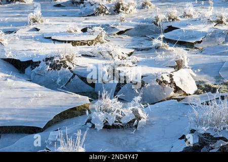 collapsed ice, field flooded and then froze, water drained away leaving suspended ice which then collapsed, in field, Cowdray Ruins, Sussex, Stock Photo