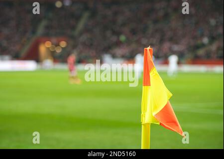 Flag in the corner of football pitch at the stadium during the match. Stock Photo