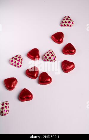 photo envelopes in red wrapping with hearts on a white background Stock Photo