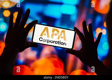 In this photo illustration, the APA Corporation logo is seen displayed ...