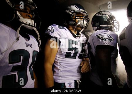 Philadelphia Eagles Joselio Hanson (21) and Stewart Bradley (55) celebrate  an interception by teammate Quintin Mikell (27) against the New York Giants  in the fourth quarter of an NFC Divisional Playoff game.