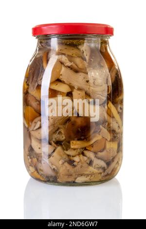 Mushrooms marinaded in glass jars with red cap. Isolated on white with clipping path included Stock Photo