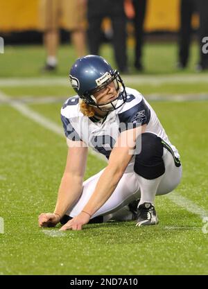 Seattle Seahawks punter Jon Ryan (9) bobbles the ball while running for 26  yards on a fake punt against the Los Angles Rams at CenturyLink Field in  Seattle, Washington on December 15