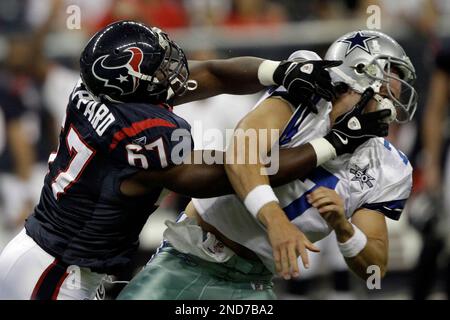 Dallas Cowboys quarterback Stephen McGee (7) is hit as he tries to throw by Houston  Texans defensive tackle Malcolm Sheppard (67) during the fourth quarter of  an NFL preseason football game Saturday