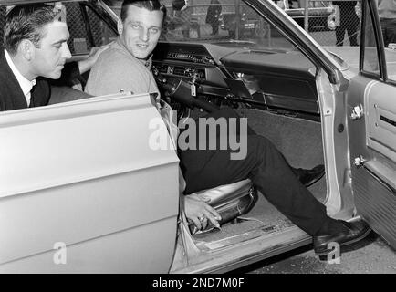 Yankee outfielder Roger Maris gets into car as he leaves Yankee