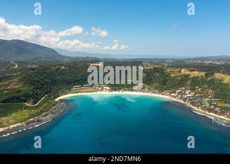 Aerial view of Blue lagoon with sandy beach. Pagudpud, Ilocos Norte, Philippines. Stock Photo