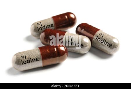 Iodine capsules on white background. Mineral element Stock Photo