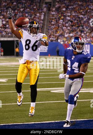 New York Giants cornerback Terrell Thomas (24) pushes Tennessee Titans  running back Chris Johnson (28) out of bounds after a 42-yard run during  fourth quarter NFL football action between the New York