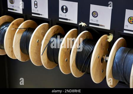 Dielectric cables in rolls on stand Stock Photo