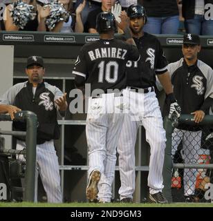 The Chicago White Sox Joe Crede (24) is congratulated by third base coach  Joey Cora after hitting a 380 foot solo home run in the fifth inning  against the Baltimore Orioles Bruce