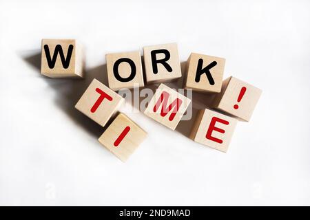 Work Time text on wooden blocks lying on a white background. Business Stock Photo