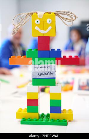 Smiling Toy robot made from toy plastic colorful blocks Stock Photo