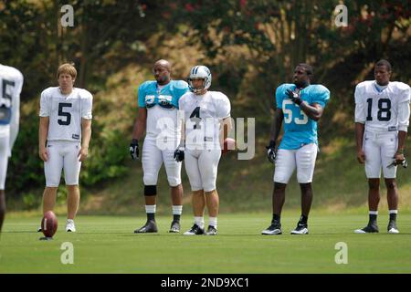 Carolina Panthers punter Jason Baker (7) consoles kicker John Kasay (4)  after he missed a 50 yard field goal attempt that contributed to the  Panthers 34-28 overtime loss to the New York