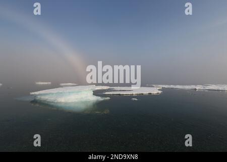 Travelling in the North Polar region, Arctic, Fury Beach in Canada with fog bow Stock Photo