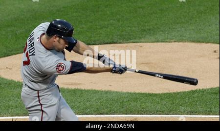 Minnesota Twins' J.J. Hardy hits a fly ball to left field in the sixth  inning of a baseball game against the Detroit Tigers Tuesday, April 27, 2010  in Detroit. Tigers' left fielder