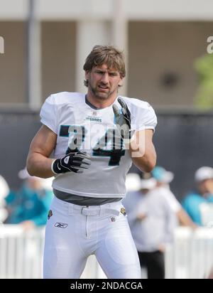 Jacksonville Jaguars defensive end Aaron Kampman (74), left, lines up at  the line of scrimmage during the first half of an NFL football game against  the Denver Broncos in Jacksonville, Fla., Sunday,