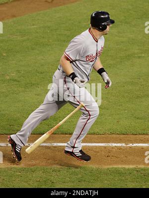 Adam Dunn of the Washington Nationals looks at his son Brady Dunn