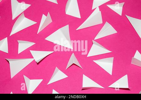 A Pink and White Geometric Folded Paper Triangle Shapes for Background Craft Stock Photo