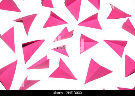 A Pink and White Geometric Folded Paper Triangle Shapes for Background Craft Stock Photo