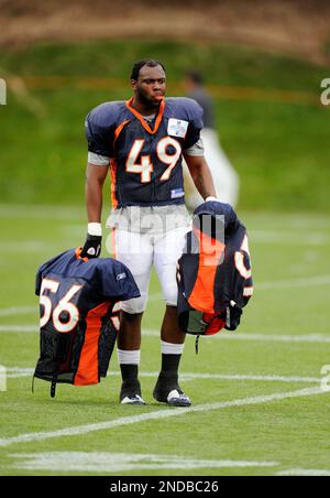 Denver Broncos rookie linebacker Devin Bishop heads to the field