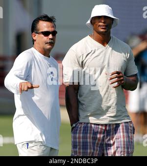 Former Tennessee Titans running back Eddie George, second from left, stands  with family members of the late Titans quarterback Steve McNair, as the  numbers for George and McNair are retired during halftime