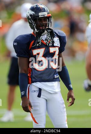 New York Jets running back LaDainian Tomlinson (21) celebrates his  game-winning two-yard touchdown run with Denver Broncos cornerback Nate  Jones watching in the fourth quarter at Invesco Field at Mile High on