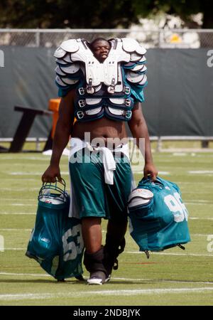 Miami Dolphins defensive end Ryan Baker (90), Miami Dolphins linebacker  Micah Johnson (57) and Miami Dolphins defensive tackle Travis Ivey (62)  during the second half of an NFL preseason football game against