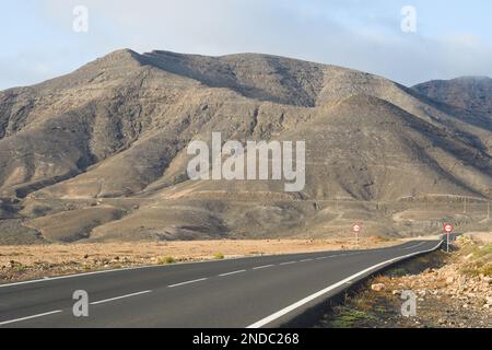 Volcano with its crater seen from the road in Fuerteventura Stock Photo