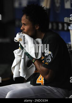 Oakland Athletics' Coco Crisp sits in the dugout during a spring training  baseball game against the Arizona Diamondbacks in Phoenix, Thursday, March  18, 2010. (AP Photo/Jeff Chiu Stock Photo - Alamy