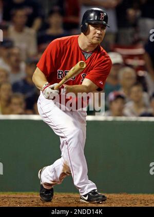 The Boston Red Sox's Shane Victorino (18) tosses his helmet after