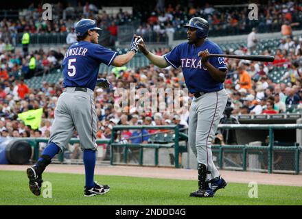 Texas Rangers' Josh Hamilton is congratulated by teammate Vladimir Guerrero  after hitting a solo homerun during the 5th inning against the San  Francisco Giants in game 3 of the World Series at