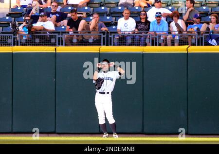 Seattle Mariners' Ichiro Suzuki adjusts his helmet after hitting a foul  ball against the Los Angeles Angels during the first inning of a baseball  game Saturday, Aug. 19, 2006, in Anaheim, Calif. (