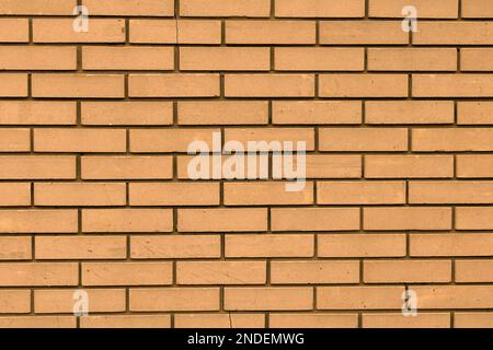 Beige sepia color brick wall stone material pattern texture background Stock Photo